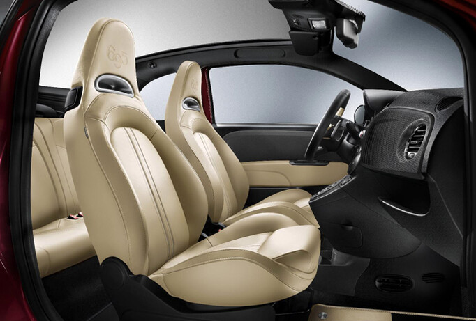 The seats have been upholstered in sand beige leather and have the 695 emblem embossed in the head rests.