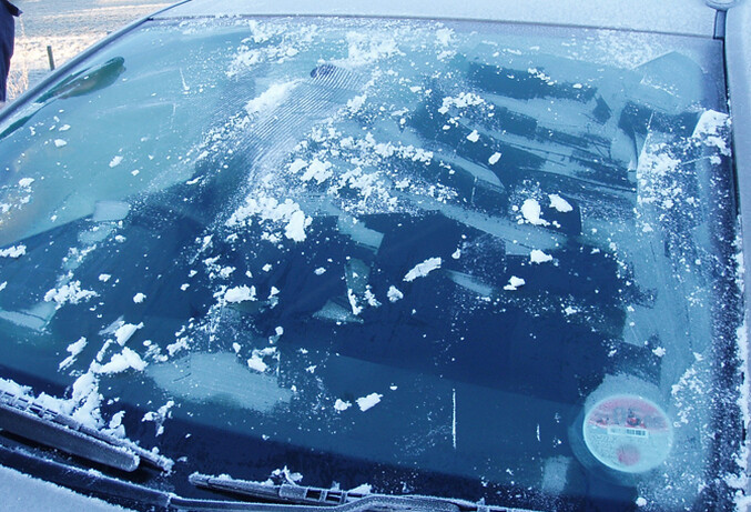 Motorists are wasting millions every winter by leaving their engines running while they defrost their cars.