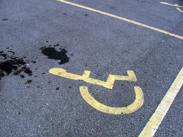 A pensioner has been sent to prison for assaulting another pensioner over a disabled parking bay.