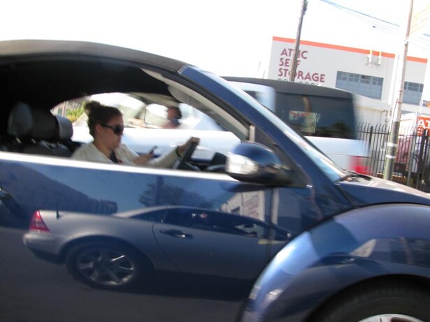 A woman who killed a fellow motorist after using two phones at the wheel was jailed recently.