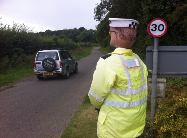 The scarecrow cop in action.