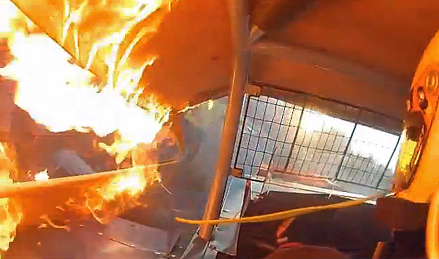Watch this racing driver struggle to escape his burning car