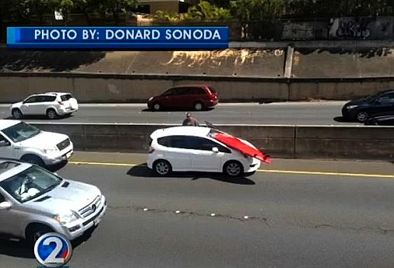 Driver almost killed by surfboard flying through windscreen