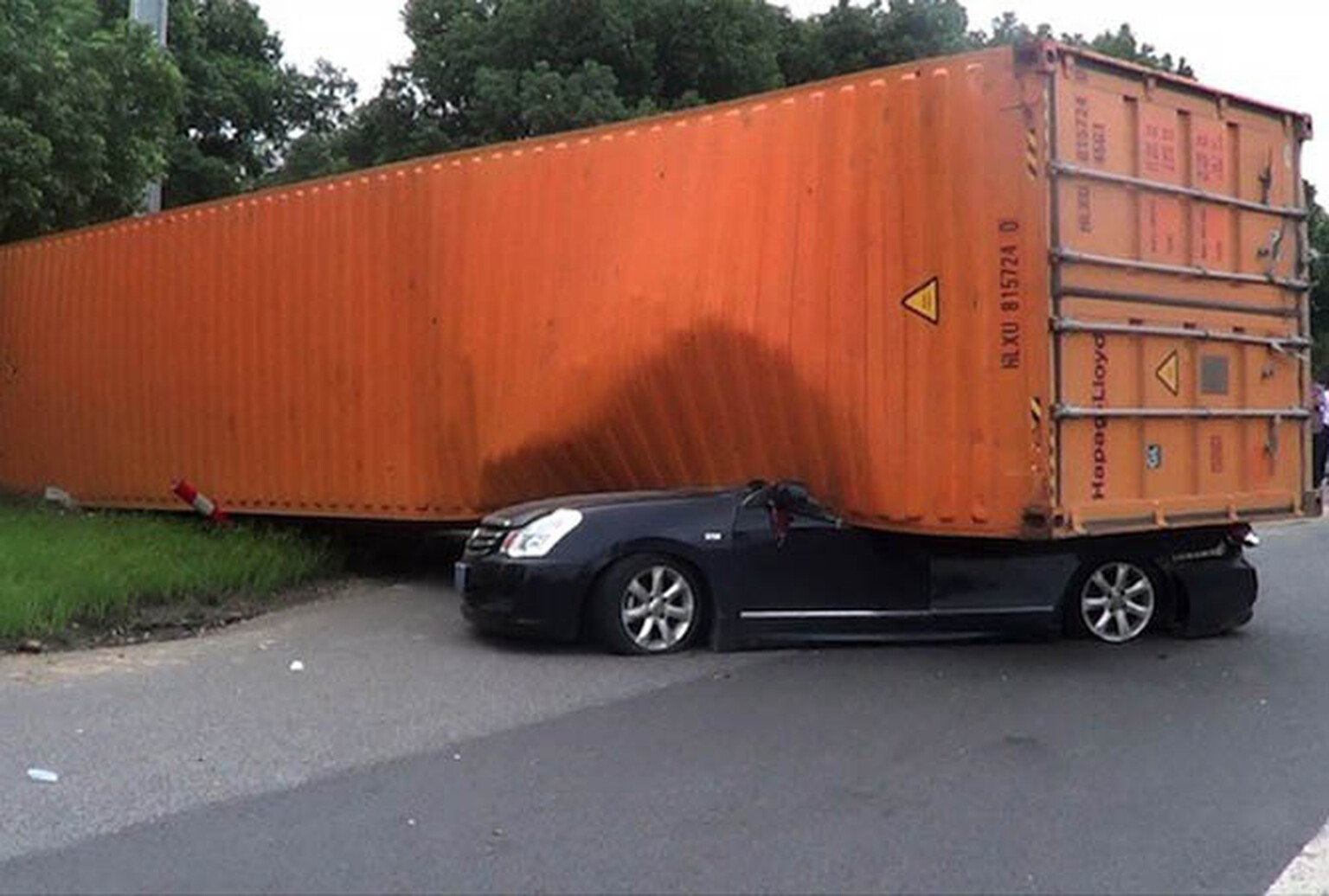 Woman survives horrific shipping container accident