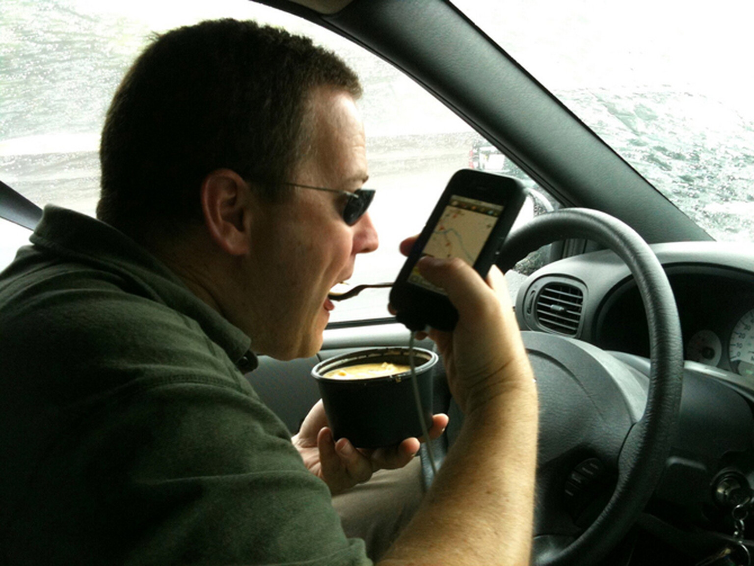 Hundreds of drivers caught using iPads, applying makeup and brushing teeth