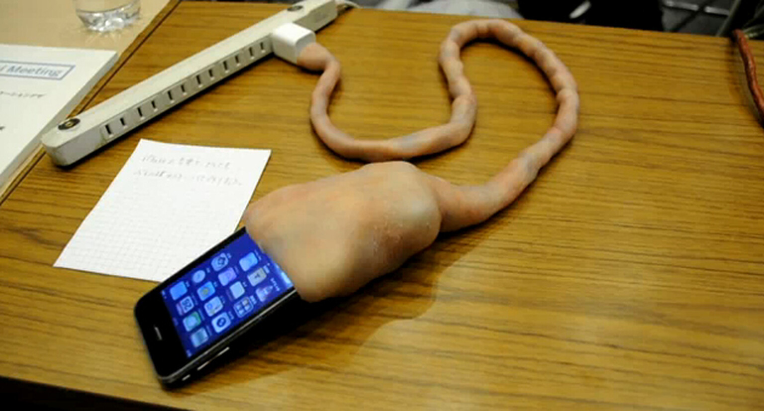 Umbilical cord iPhone charger charges your battery, makes you lose your breakfast