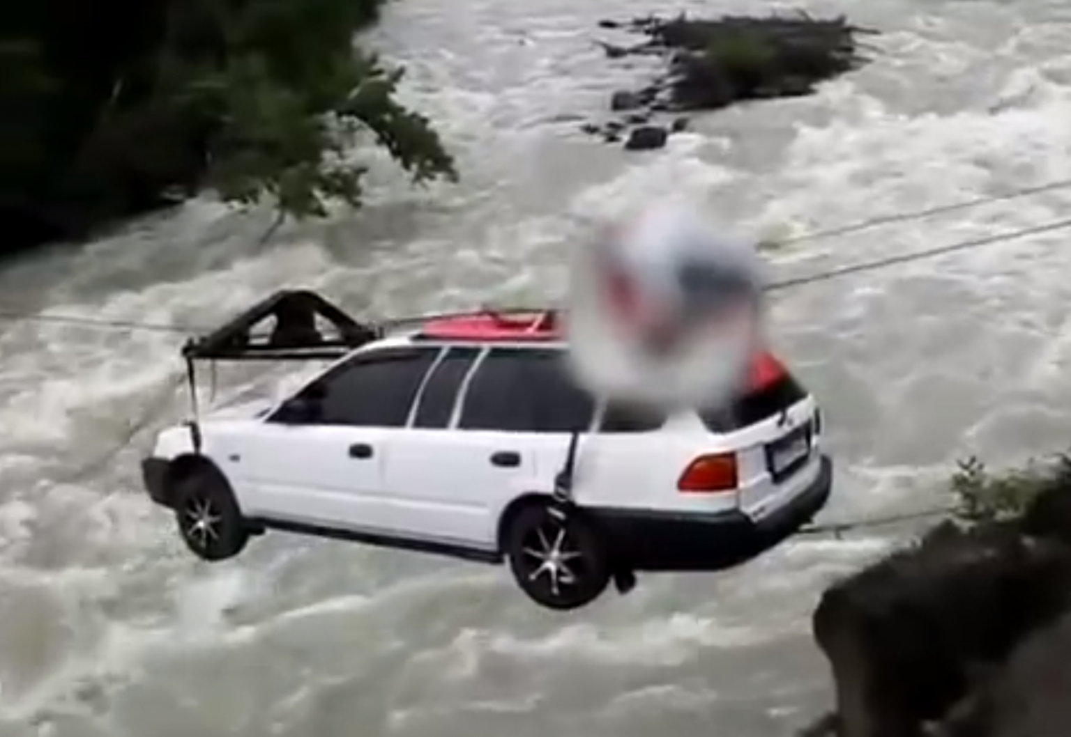 Man sends car across raging river on zip line