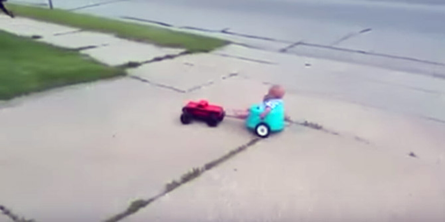 Video: Baby towed around by remote control car