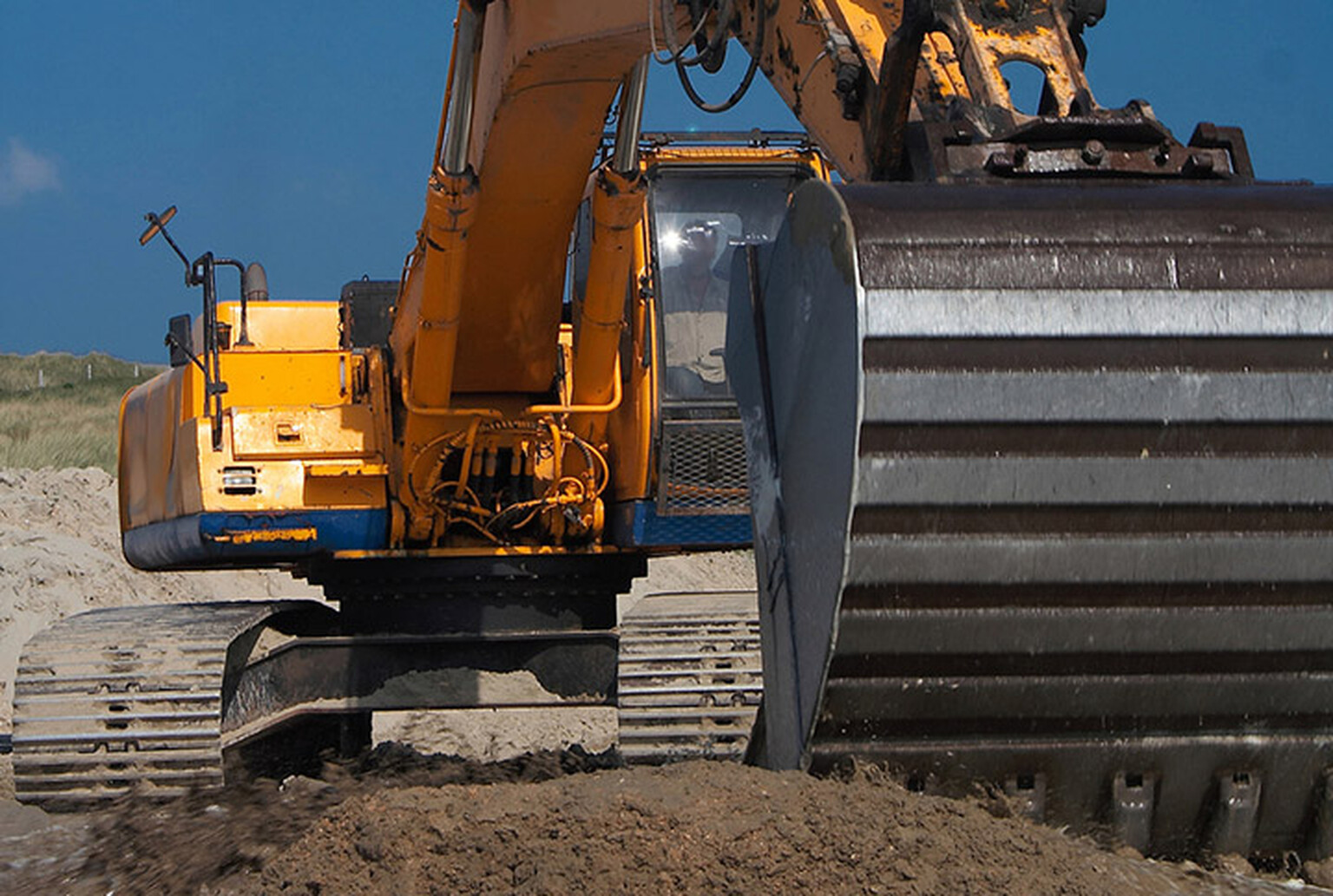 Man blocks in trespassing travellers with digger after they demand £8,000 to leave