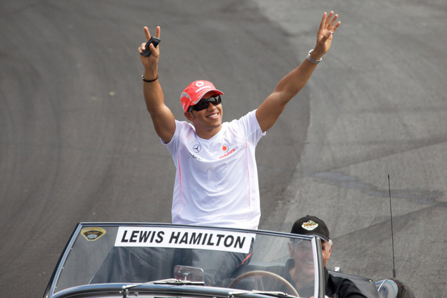 Lewis Hamilton caught using his iPhone at the wheel