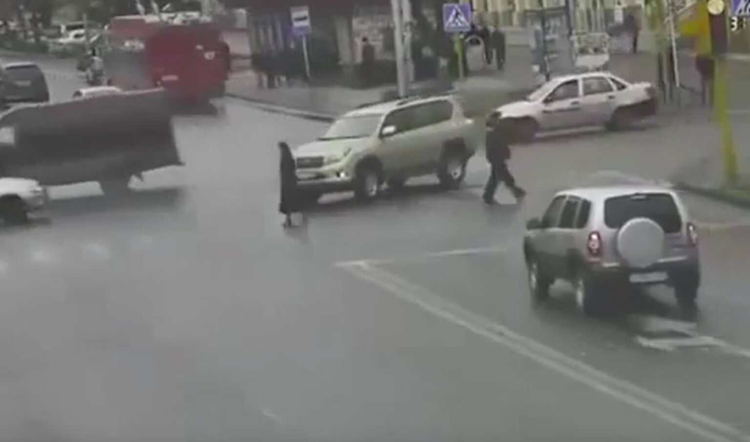 Video: Motorist drives over pedestrian's head twice