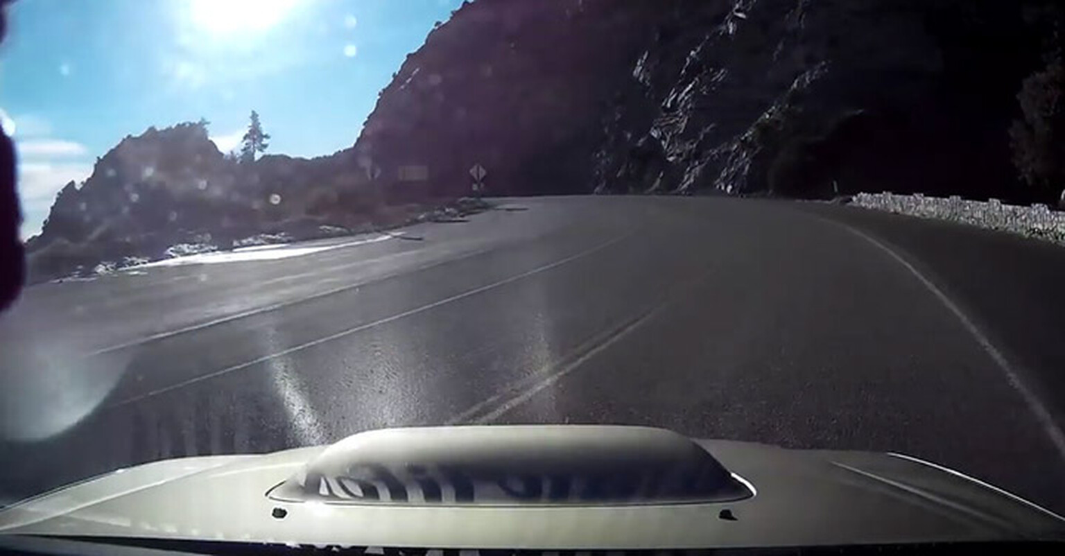 The moment a motorist drives off a cliff captured on video