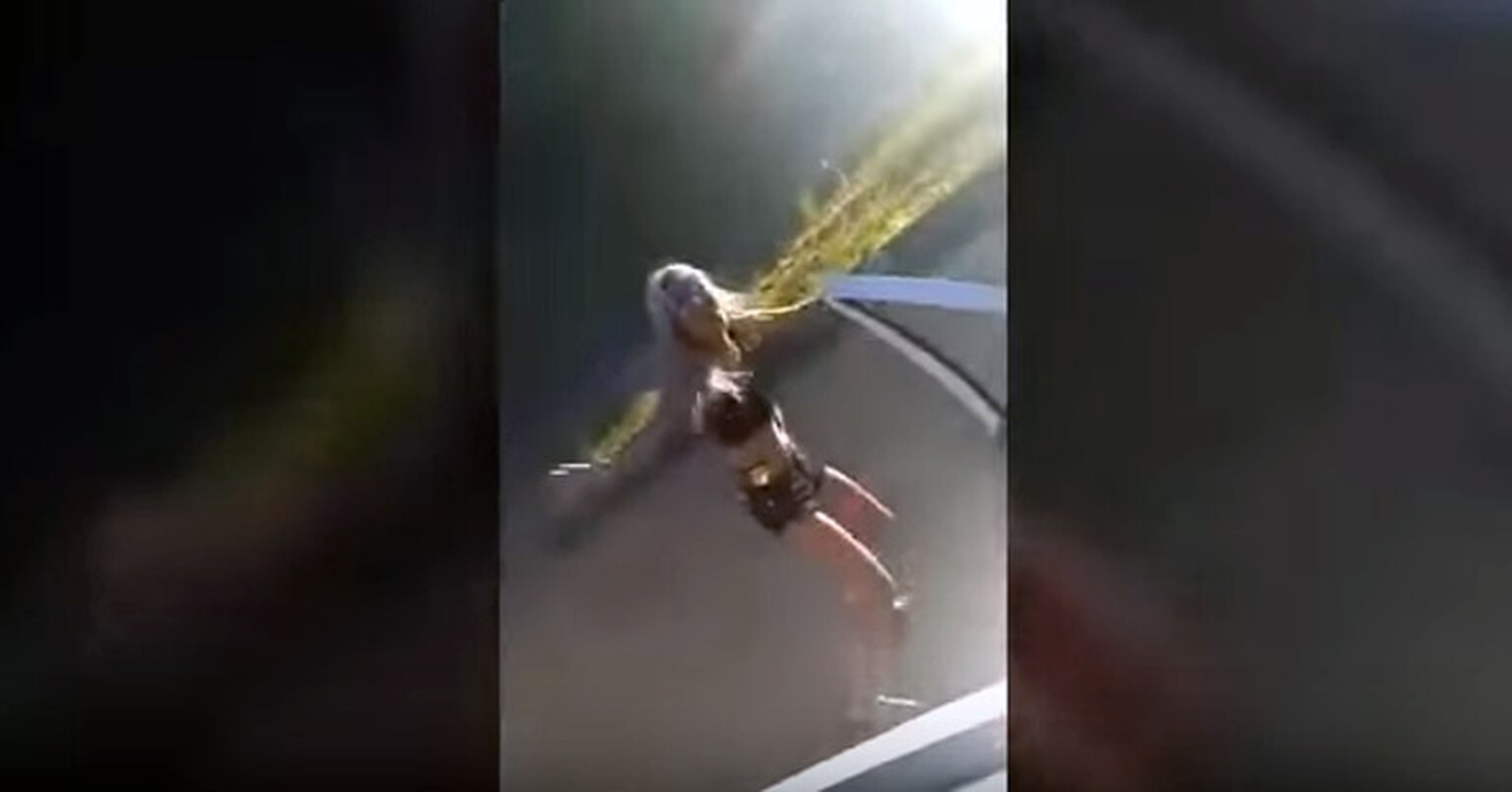 Watch a dancing blonde girl cause a car crash
