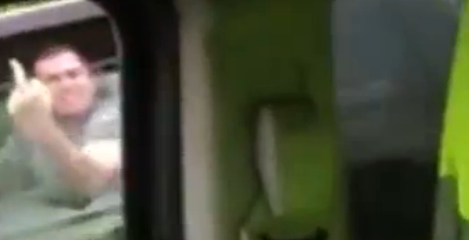 Watch this road rage driver swear at a female motorist... then crash