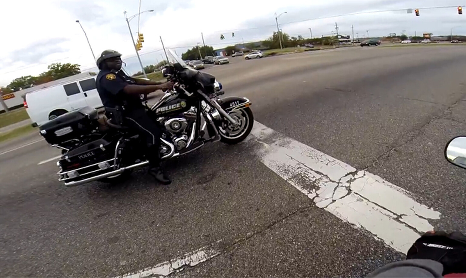 Cop drag races with biker on public road