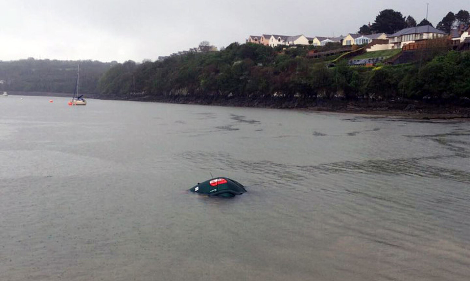 Car rolls into the sea after driver nips out to the toilet