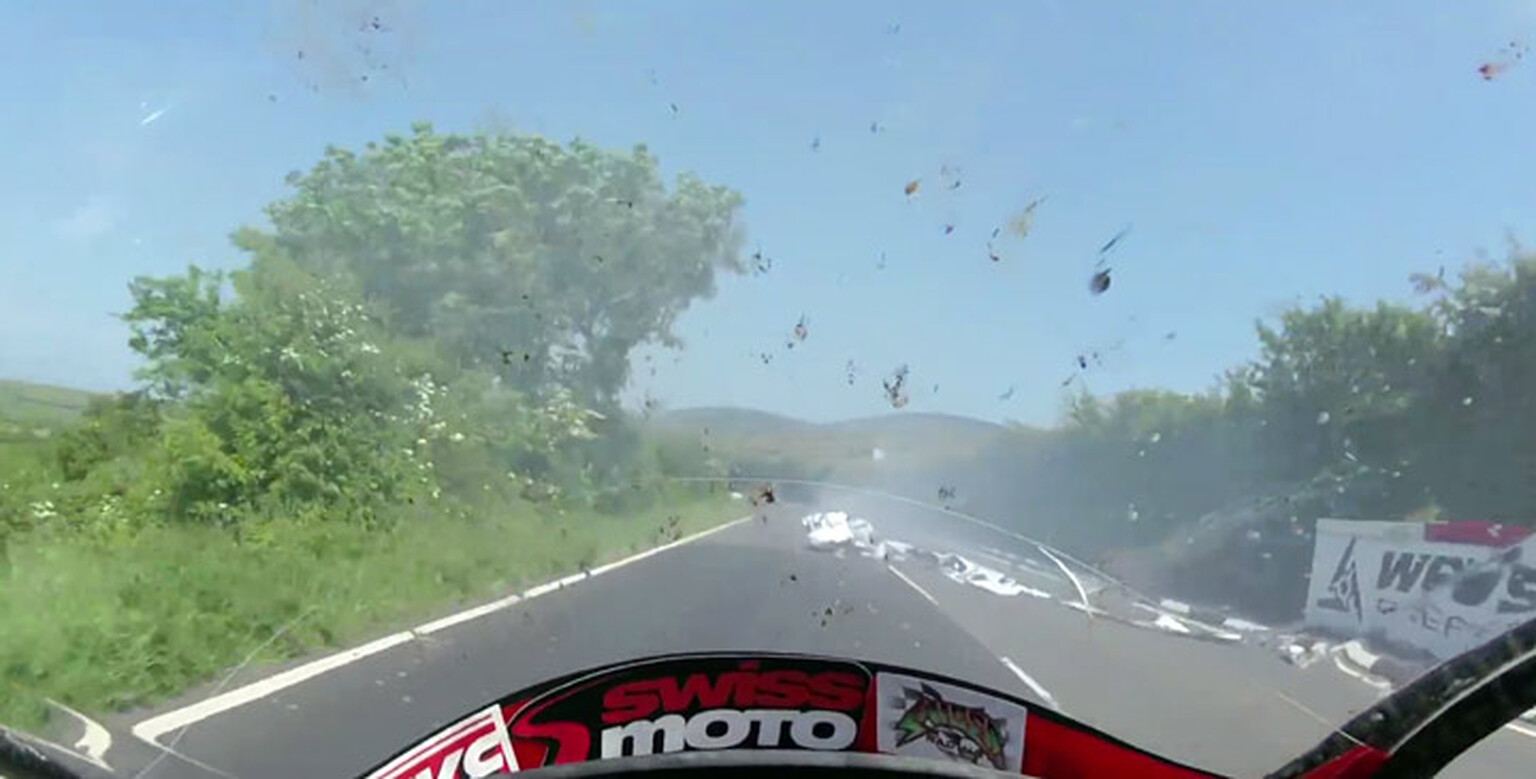 Watch a TT racer narrowly avoid hitting a rider after epic crash