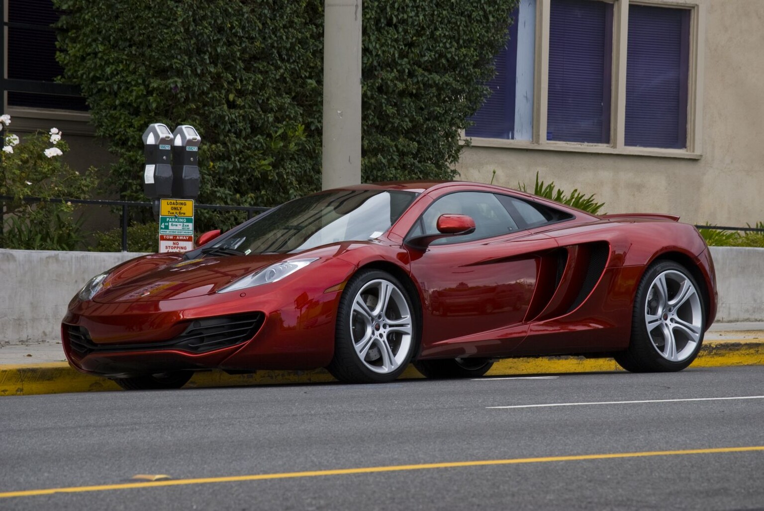 Joker jumps around on someone else’s £250,000 McLaren