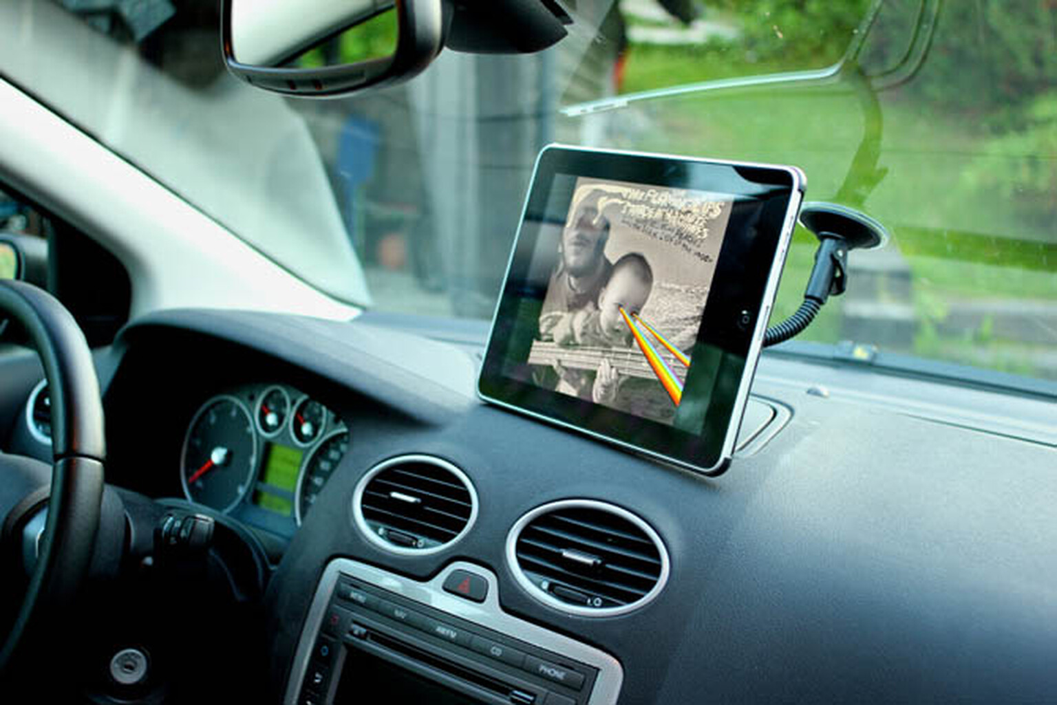 Motorist photographed playing iPad game while driving on motorway