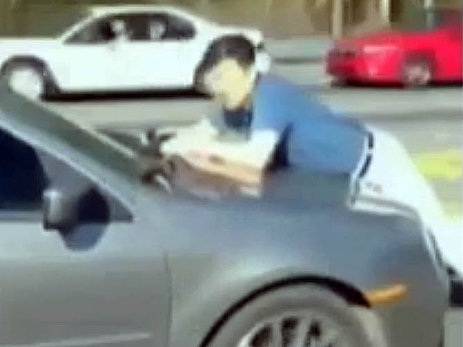 Hit and run driver carries man for two miles along highway