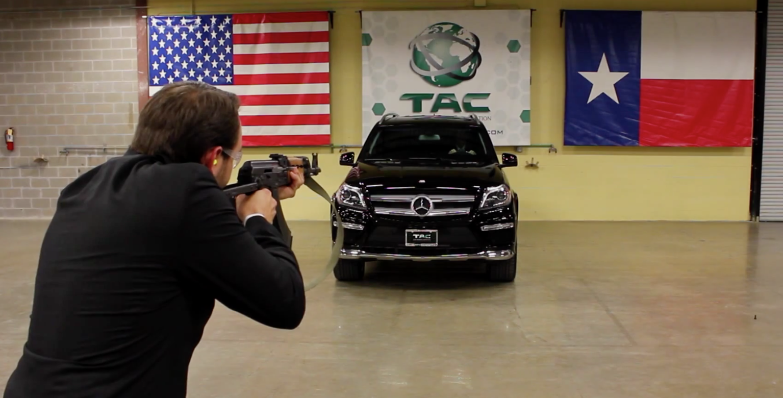 Bulletproof car boss lets employee fire AK47 at him whilst sat in armoured vehicle