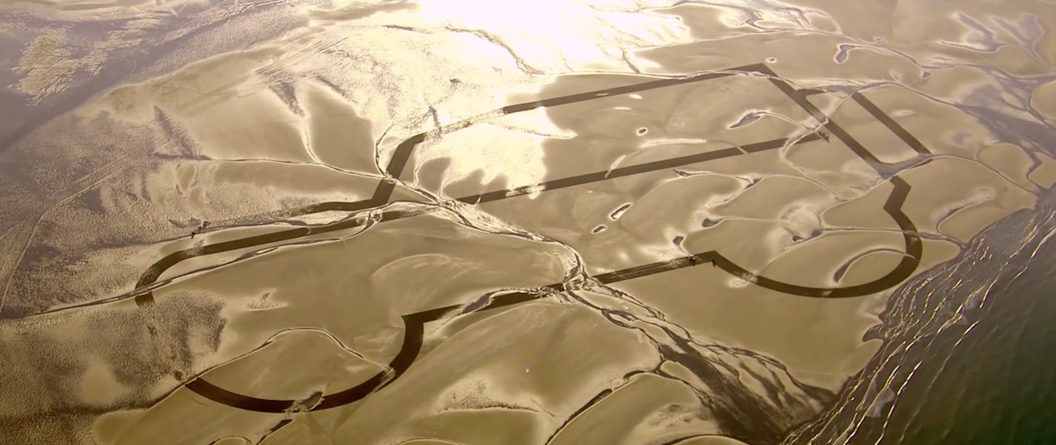 Watch Land Rover draw a huge Defender in the sand as it says goodbye to iconic 4x4