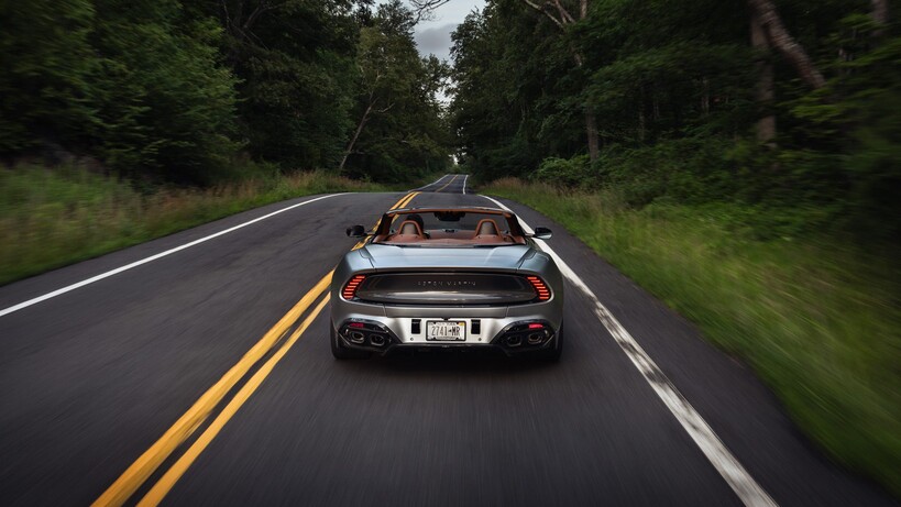 Aston Martin Vanquish driving from the back