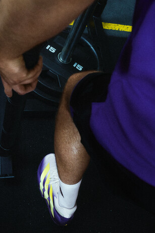 Adizero dropset being worn while lifting weights