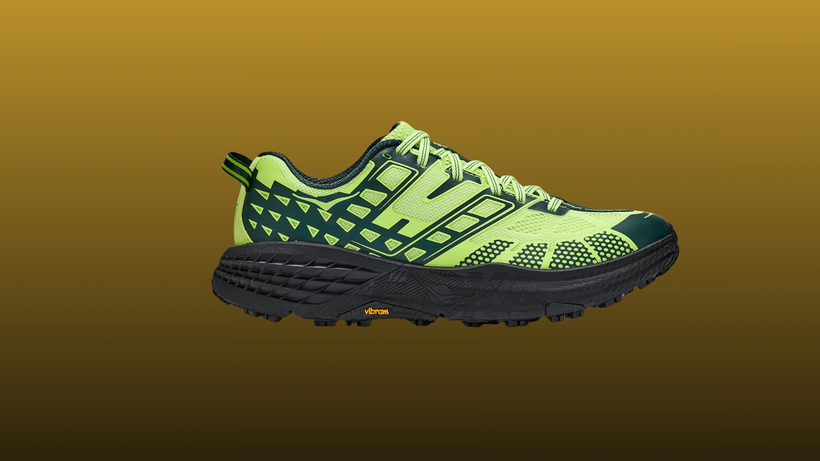 Hoka Speedgoat 2 on a mustard to black gradient background