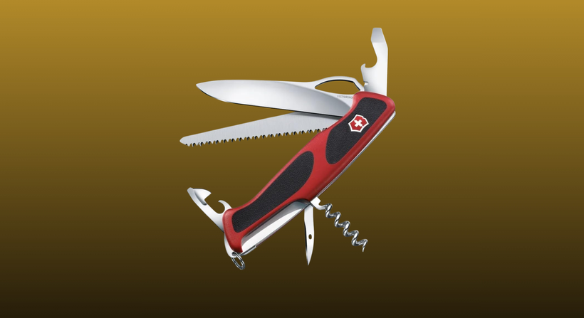 Victorinox Ranger 79 M Grip on a mustard to black gradient background