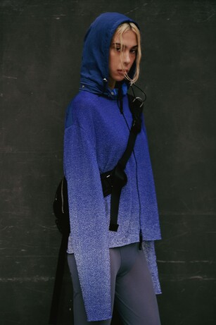 Ambush image showing a woman in a blue jacket