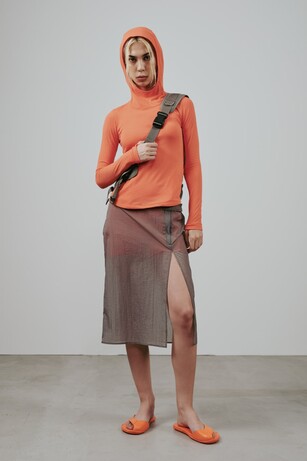 Ambush image showing person wearing a top with a hood
