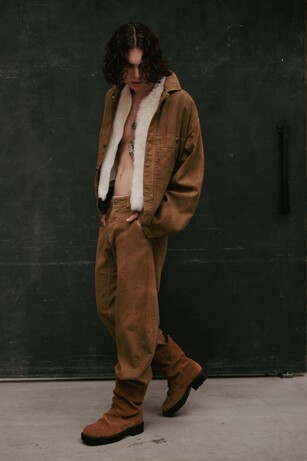 Ambush image showing a man weaing a fuzzy coat