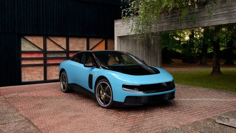 Blue Ferrari Luce outside a barn