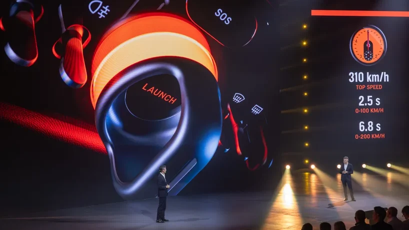 Ferrari Luce launch showing two men on stage