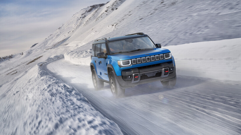 Blue Jeep recon on a snowy road
