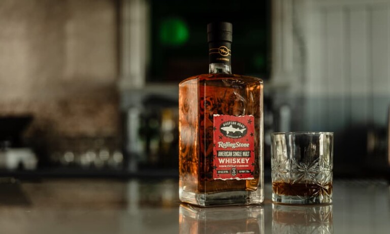 Dogfish Head Rolling Stone whiskey with a glass