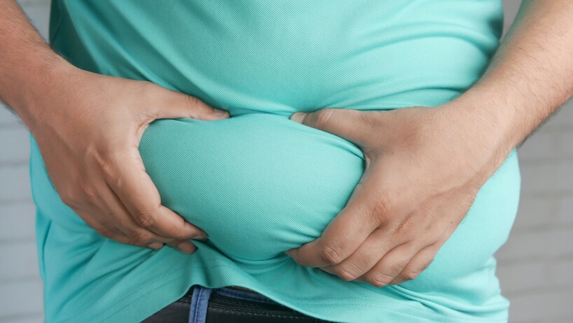 Man holding his stomach fat