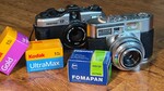 The Pentax 17 and a vintage Voigtlander film camera, adorned with film from Kodak and Fomapan