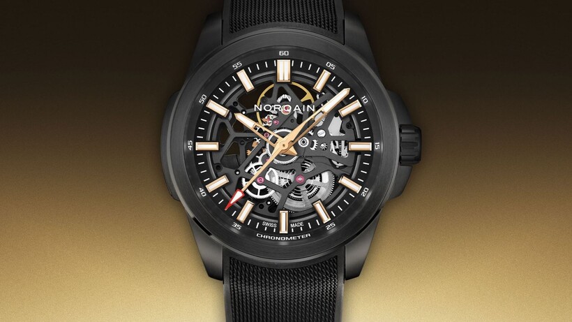 Norqain Independence Skeleton Titanium DLC watch with black openworked dial and red-gold accents