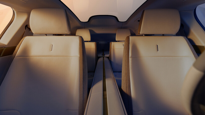 Jaguar Type 01 electric GT interior with central spine and brass-inspired detailing