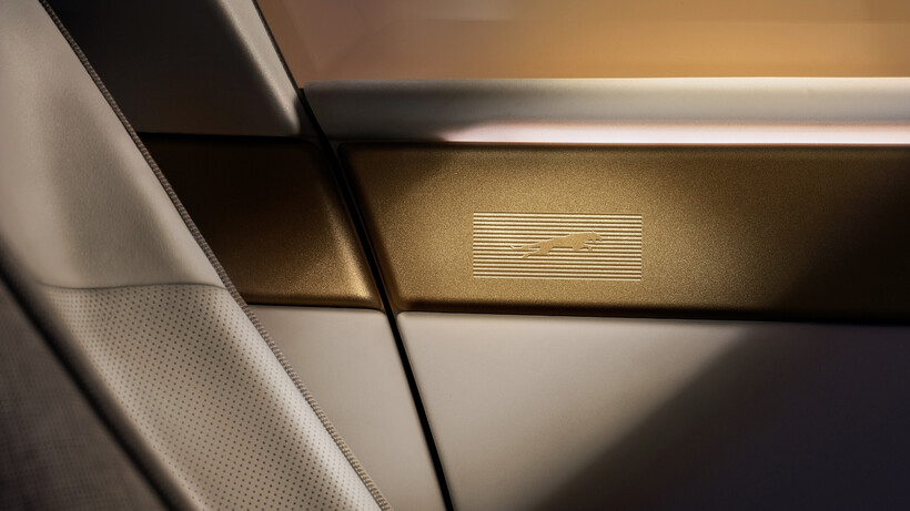 Jaguar Type 01 electric GT interior with central spine and brass-inspired detailing