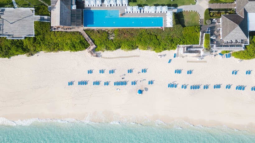 Aerial view of The Ocean Club in the Bahamas with turquoise water, beach and resort pool