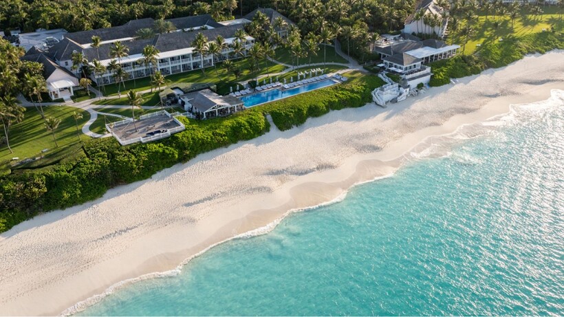 Aerial view of The Ocean Club in the Bahamas with turquoise water, beach and resort pool