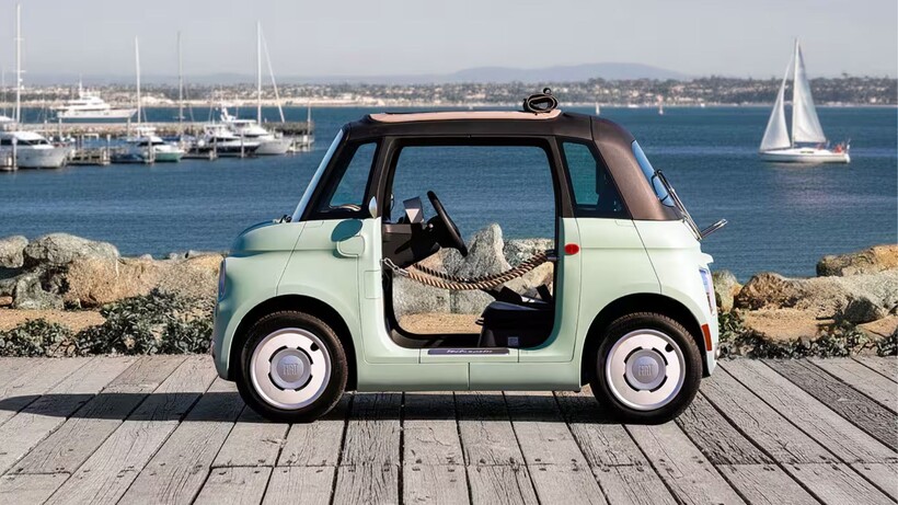 Mint green Fiat Topolino electric microcar designed for resorts, gated communities and short local trips