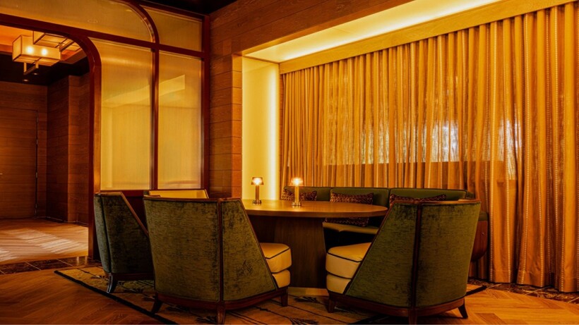 Redesigned Bourbon Lounge at Four Seasons Hotel Washington, DC with warm lighting and residential-inspired furnishings