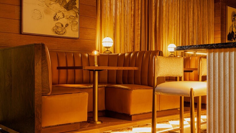 Redesigned Bourbon Lounge at Four Seasons Hotel Washington, DC with warm lighting and residential-inspired furnishings