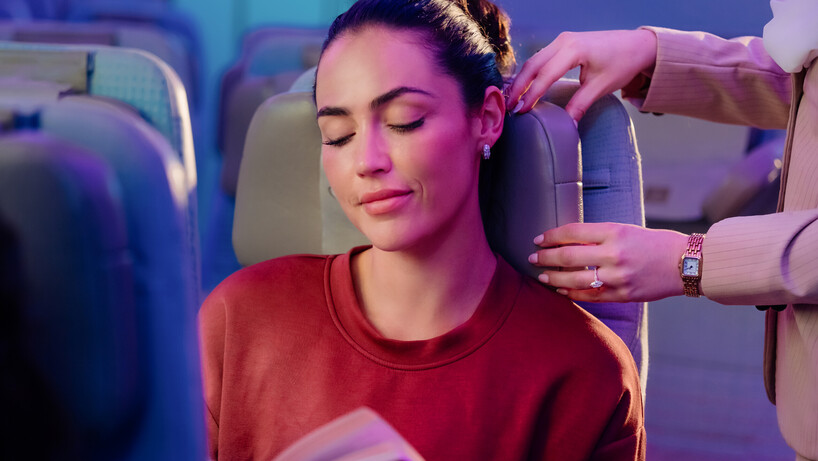 The arms on Emirate's new economy seat headrest being adjusted